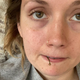 Photo of the author with a cherry stem poking out of mouth